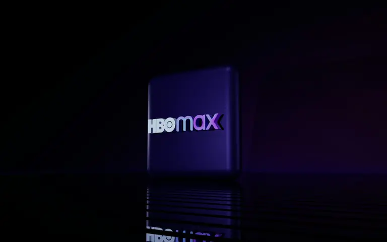 Hbo max logo on a dark reflective surface