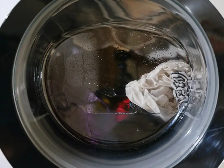 Washing machine drum with clothes and water