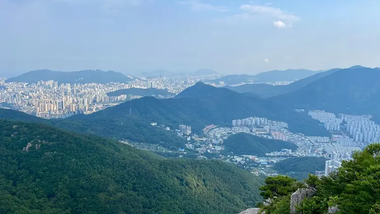 A view of a city from a mountain top