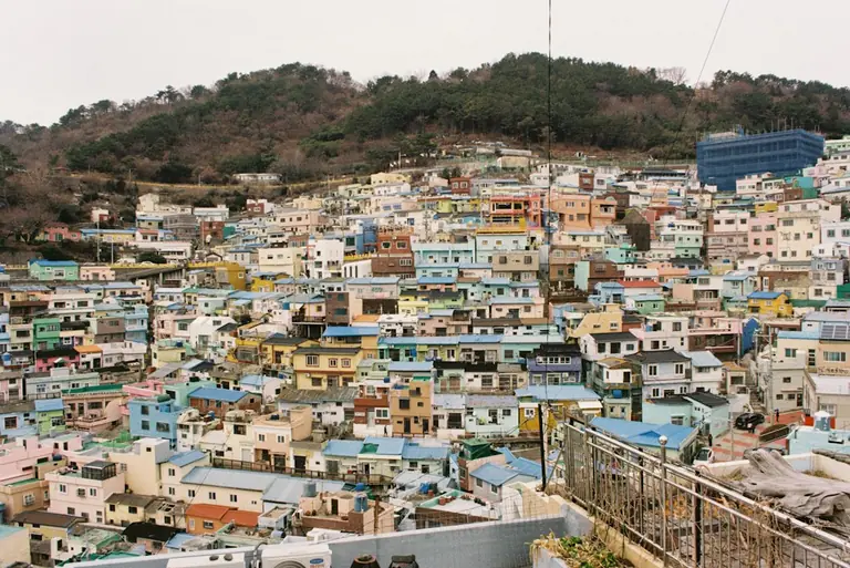 a city with lots of colorful buildings on top of it