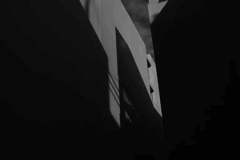Abstract shadows and light on a dark surface