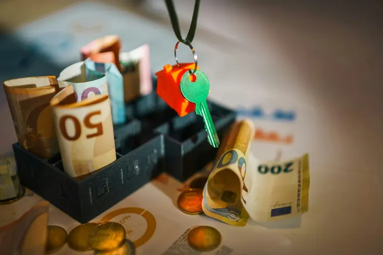 A bunch of money sitting on top of a table